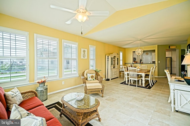 24928 Rivers Edge Rd, Millsboro, DE 19966 - living area featuring plenty of natural light, light tile patterned floors, ceiling fan, and lofted ceiling