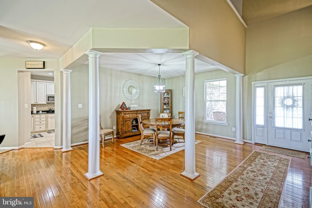 24928 Rivers Edge Rd, Millsboro, DE 19966 - entrance foyer featuring ornate columns and light wood-type flooring