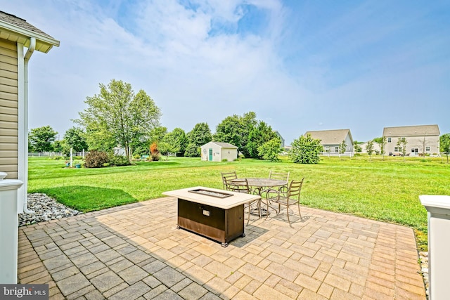 24928 Rivers Edge Rd, Millsboro, DE 19966 - view of patio featuring a shed and a fire pit