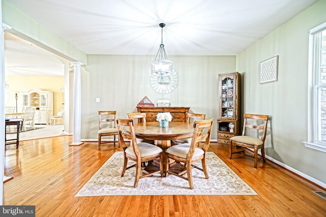 24928 Rivers Edge Rd, Millsboro, DE 19966 - dining space with ornate columns, wood finished floors, and healthy amount of natural light