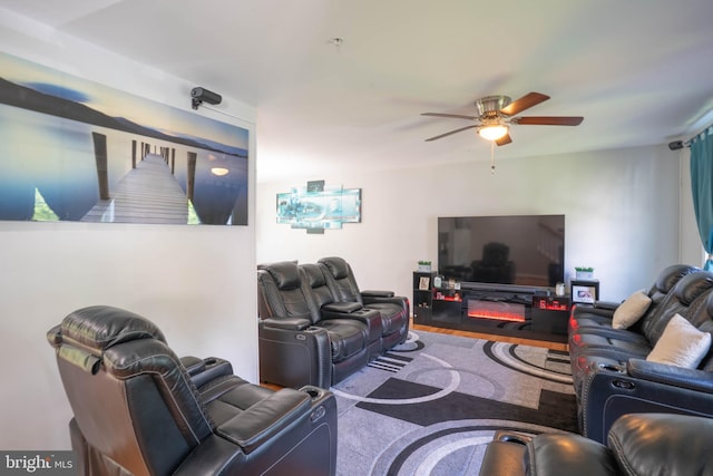 living area with a ceiling fan
