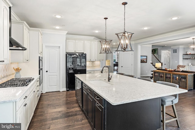 1760 Florence Rd, Mount Airy, MD 21771 - kitchen featuring black refrigerator with ice dispenser, a sink, a chandelier, crown molding, and gas stovetop