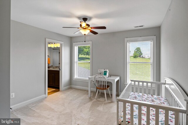 1760 Florence Rd, Mount Airy, MD 21771 - bedroom with light colored carpet, baseboards, a crib, and ceiling fan
