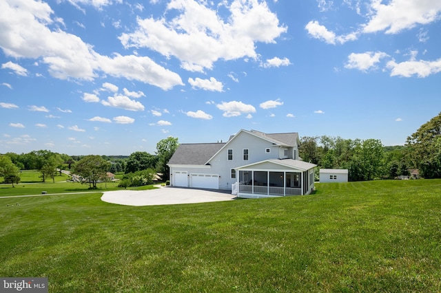 1760 Florence Rd, Mount Airy, MD 21771 - back of house featuring a sunroom, an attached garage, a lawn, and driveway