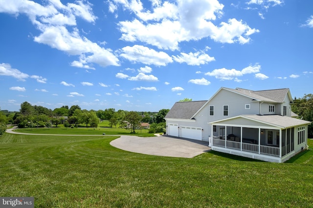 1760 Florence Rd, Mount Airy, MD 21771 - back of house with a sunroom, a garage, driveway, and a lawn