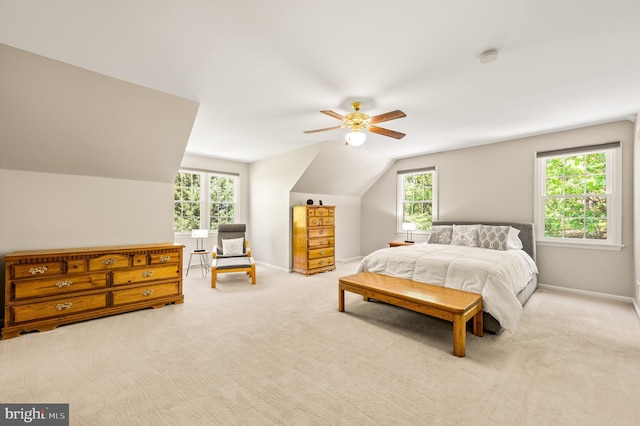 bedroom featuring vaulted ceiling, baseboards, a ceiling fan, and carpet floors