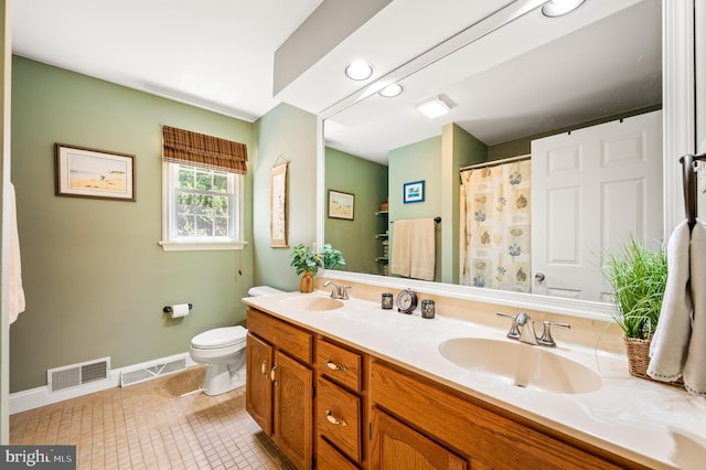 bathroom featuring toilet, tile patterned flooring, baseboards, double vanity, and a shower with curtain
