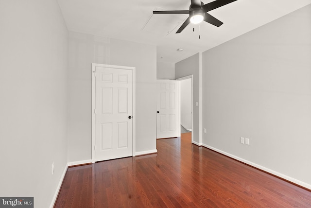 unfurnished bedroom featuring wood finished floors, baseboards, and ceiling fan