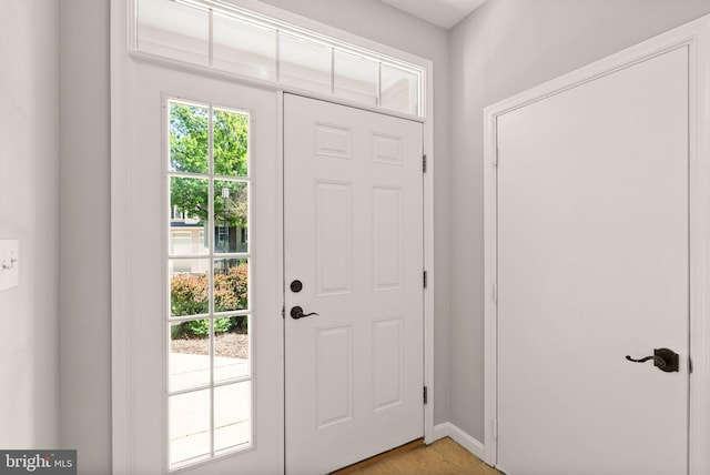 entryway with healthy amount of natural light and baseboards