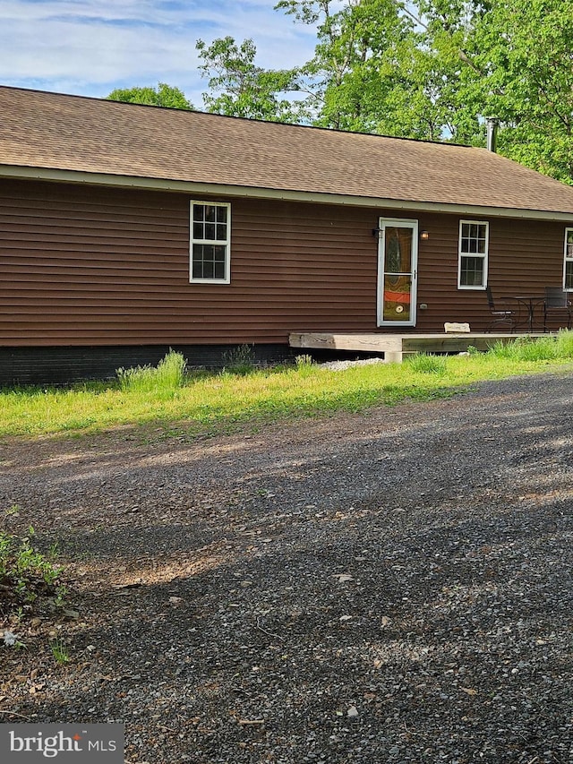 79 Whiskey Still Rd, Berkeley Springs, WV 25411 - view of side of home featuring roof with shingles