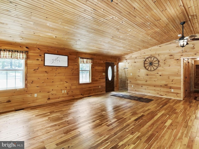 79 Whiskey Still Rd, Berkeley Springs, WV 25411 - foyer with wooden walls, hardwood / wood-style floors, vaulted ceiling, plenty of natural light, and ceiling fan