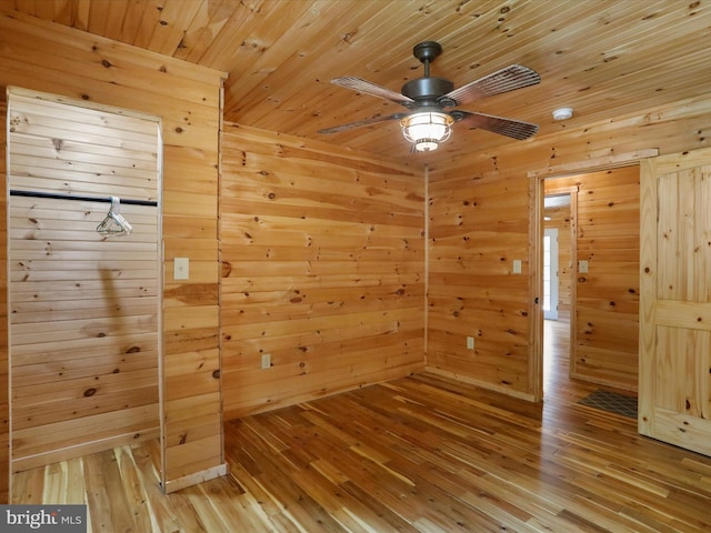 79 Whiskey Still Rd, Berkeley Springs, WV 25411 - empty room featuring wooden walls, light wood-style floors, a ceiling fan, and wood ceiling