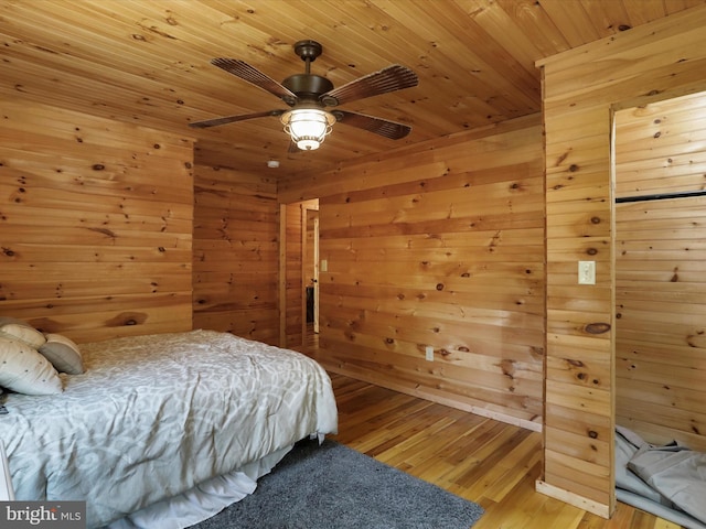 79 Whiskey Still Rd, Berkeley Springs, WV 25411 - bedroom featuring light wood-style flooring, wood walls, wooden ceiling, and a ceiling fan