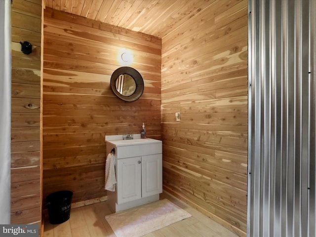 79 Whiskey Still Rd, Berkeley Springs, WV 25411 - bathroom with vanity, wood walls, wooden ceiling, and wood finished floors
