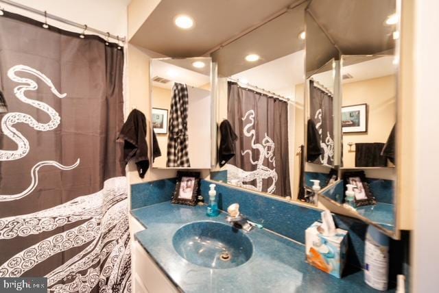full bath with vanity and recessed lighting