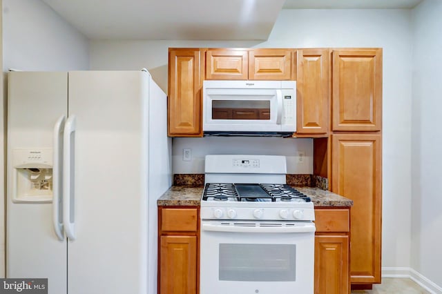 1307 Emerald St NE, Washington, DC 20002 - kitchen with white appliances and dark countertops