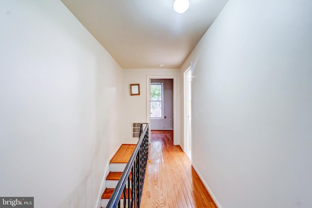 1307 Emerald St NE, Washington, DC 20002 - hall featuring light wood-type flooring, baseboards, and an upstairs landing