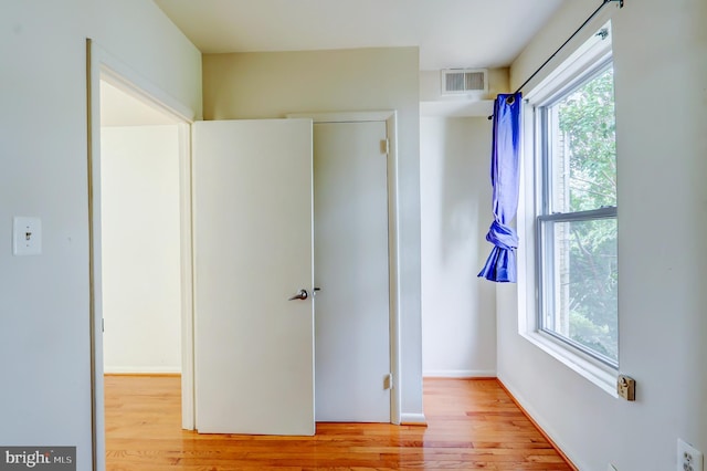 1307 Emerald St NE, Washington, DC 20002 - unfurnished bedroom featuring light wood-style floors and multiple windows