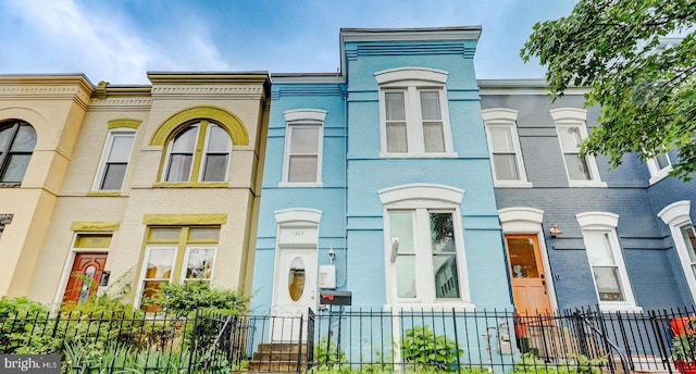 1307 Emerald St NE, Washington, DC 20002 - townhome / multi-family property with brick siding and a fenced front yard