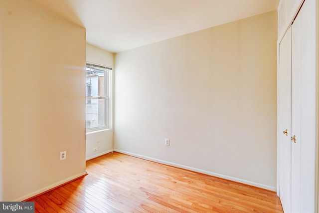 1307 Emerald St NE, Washington, DC 20002 - unfurnished bedroom with light wood finished floors, baseboards, and a closet