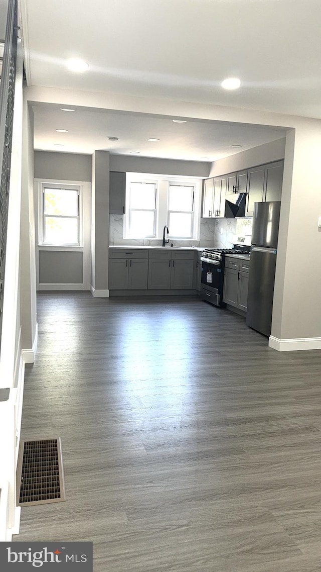 6529 Vandike St, Philadelphia, PA 19135 - kitchen with stainless steel appliances, gray cabinets, baseboards, healthy amount of natural light, and recessed lighting