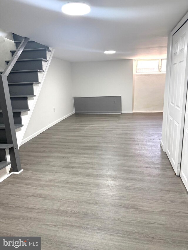 6529 Vandike St, Philadelphia, PA 19135 - below grade area featuring stairs, wood finished floors, and baseboards