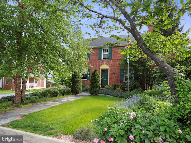 210 W 1st St, Front Royal, VA 22630 - view of front facade featuring brick siding and a front yard