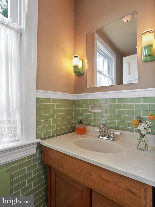 210 W 1st St, Front Royal, VA 22630 - bathroom with tile walls, vanity, and a wainscoted wall