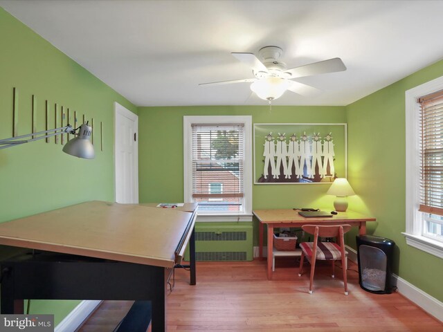 210 W 1st St, Front Royal, VA 22630 - home office with radiator heating unit, healthy amount of natural light, and wood finished floors