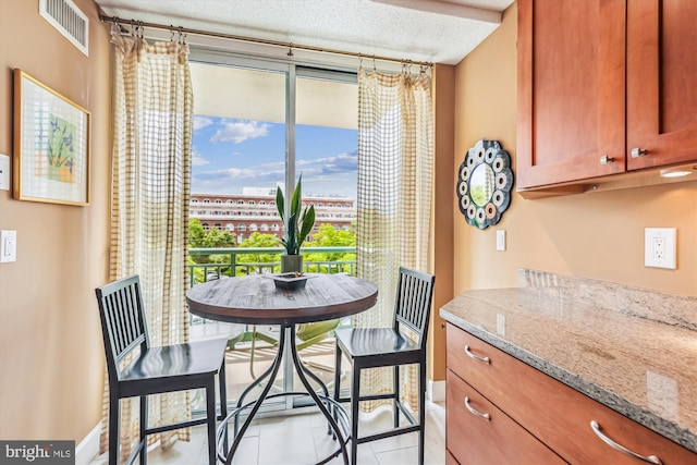 dining space with light tile patterned floors