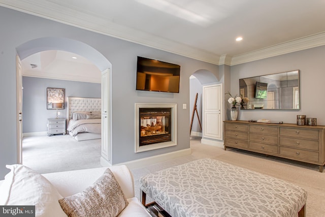 1034 Founders Ridge Ln, Mclean, VA 22102 - bedroom with arched walkways, crown molding, light carpet, a multi sided fireplace, and baseboards