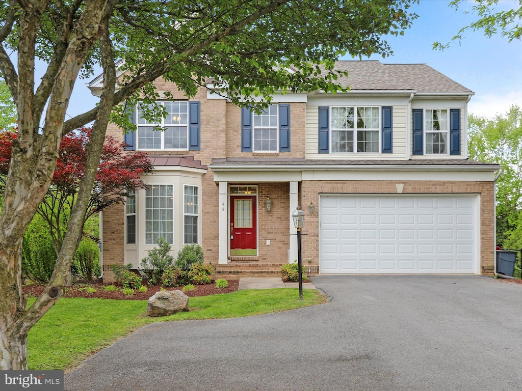 44 Folks Pt, Shepherdstown, WV 25443 - view of front of property with driveway, a garage, and brick siding