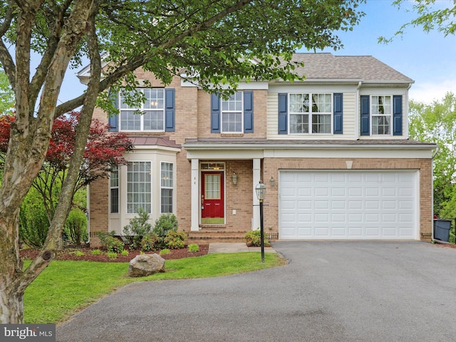 44 Folks Pt, Shepherdstown, WV 25443 - view of front of property with driveway, a garage, and brick siding