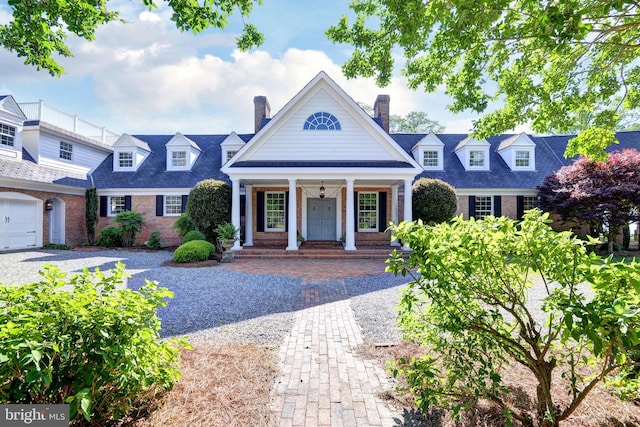 6454 Carmines Island Ln, Hayes, VA 23072 - view of front facade featuring brick siding, covered porch, and a chimney