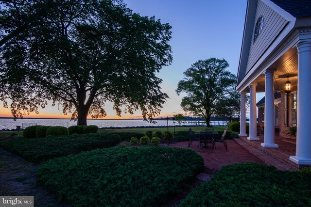 6454 Carmines Island Ln, Hayes, VA 23072 - view of yard featuring a water view and a patio area