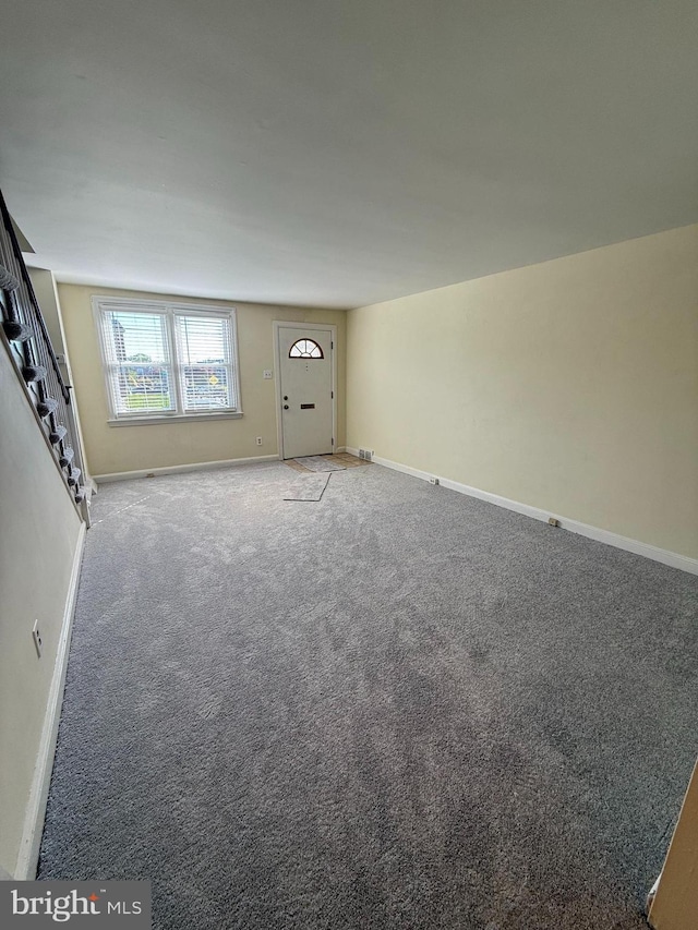 426 S Church St, Clifton Heights, PA 19018 - unfurnished living room with light carpet, baseboards, and stairs