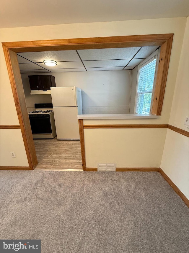 426 S Church St, Clifton Heights, PA 19018 - kitchen with white appliances, light colored carpet, baseboards, and a paneled ceiling