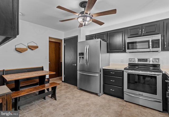 115 Bailey Settlement Hwy, Clearfield, PA 16830 - kitchen with stainless steel appliances, a ceiling fan, light countertops, and dark cabinets