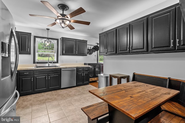 115 Bailey Settlement Hwy, Clearfield, PA 16830 - kitchen with stainless steel appliances, a sink, dark cabinets, a ceiling fan, and light countertops