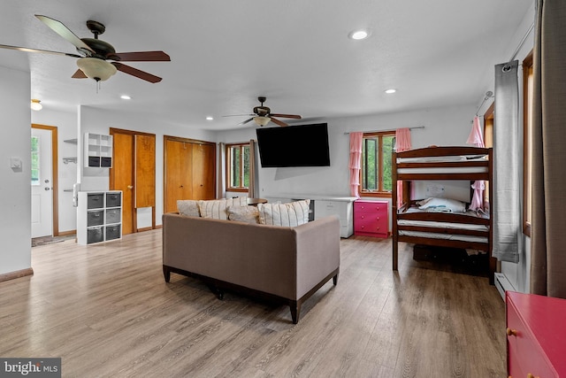 115 Bailey Settlement Hwy, Clearfield, PA 16830 - living room with ceiling fan, plenty of natural light, light wood-style floors, recessed lighting, and a baseboard heating unit
