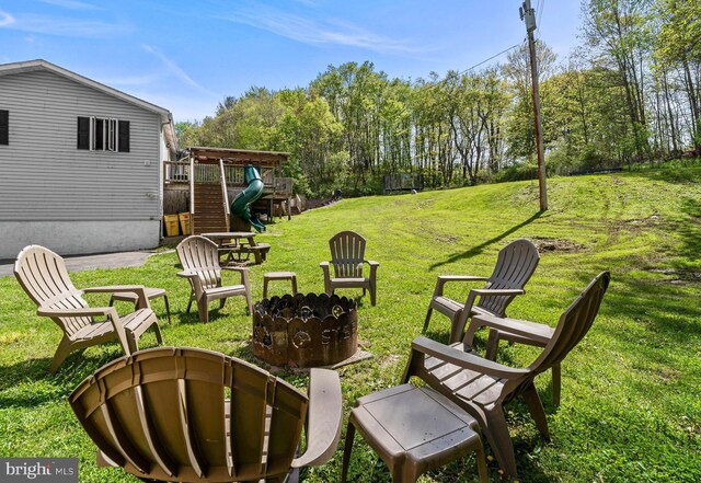 115 Bailey Settlement Hwy, Clearfield, PA 16830 - view of grassy yard with an outdoor fire pit and a playground