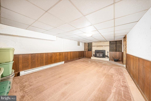 4115 Grandview Rd, Hanover, PA 17331 - finished basement featuring carpet floors, wooden walls, a paneled ceiling, a fireplace, and a baseboard radiator