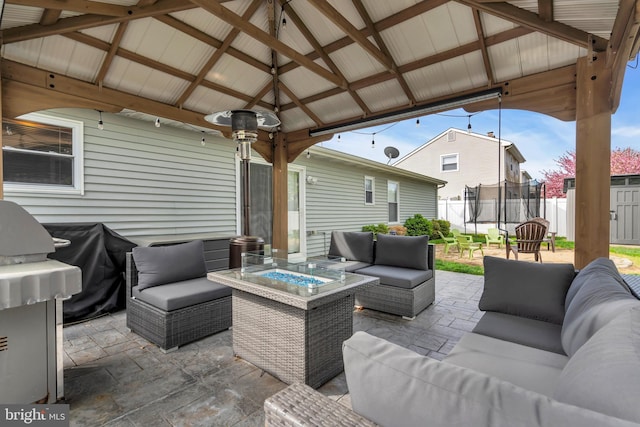 179 Ravenwood Blvd, Barnegat, NJ 08005 - view of patio / terrace with an outdoor living space with a fire pit, a trampoline, a gazebo, area for grilling, and fence