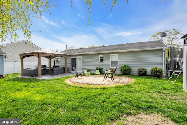 179 Ravenwood Blvd, Barnegat, NJ 08005 - rear view of house featuring a trampoline, outdoor lounge area, a gazebo, and a patio