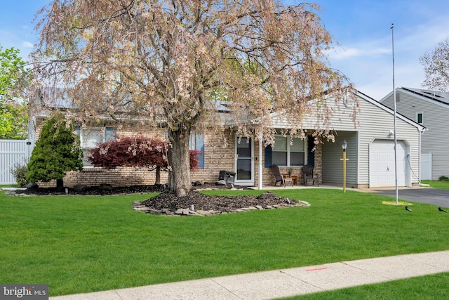 179 Ravenwood Blvd, Barnegat, NJ 08005 - view of front facade featuring an attached garage, a front lawn, a porch, and asphalt driveway