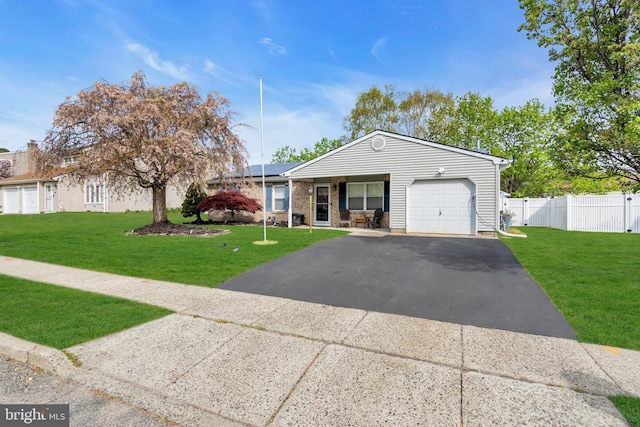 179 Ravenwood Blvd, Barnegat, NJ 08005 - ranch-style home featuring an attached garage, asphalt driveway, and roof mounted solar panels