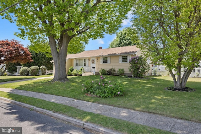 single story home featuring a chimney
