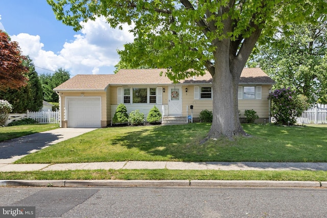 ranch-style home featuring an attached garage and concrete driveway