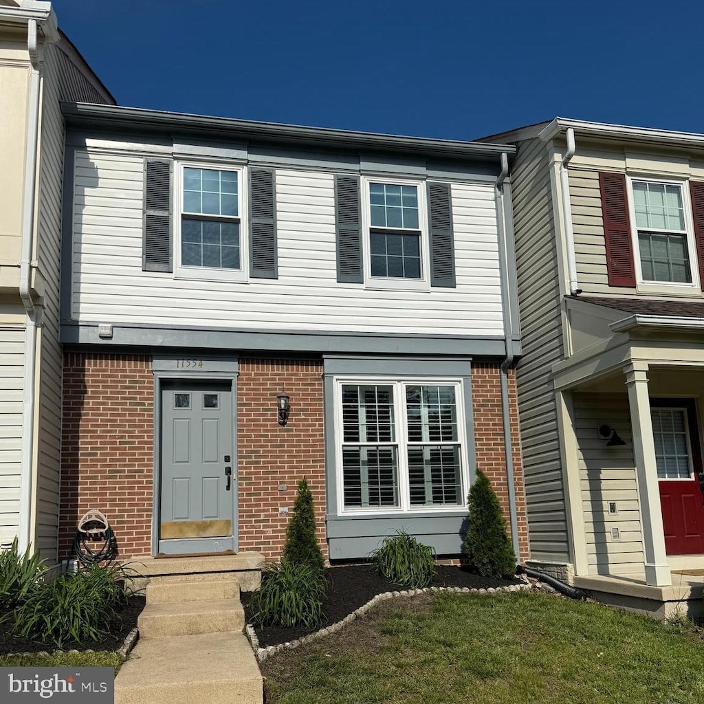 multi unit property featuring brick siding