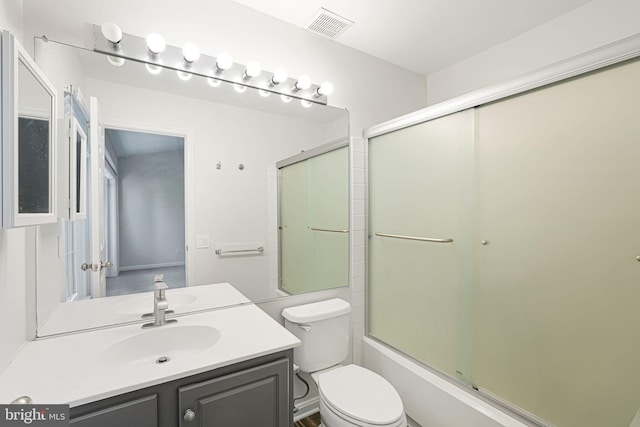 11554 Bertram St, Woodbridge, VA 22192 - bathroom with toilet, vanity, and bath / shower combo with glass door